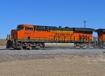 BNSF 6641 kicks up dust from freshly laid ballast